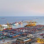 Commercial Dock With Containers And Cranes